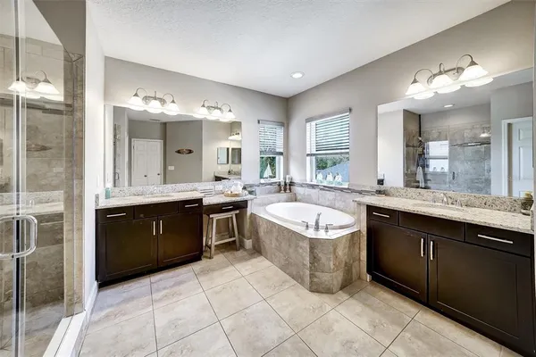 a white toilet sitting next to a bathroom sink