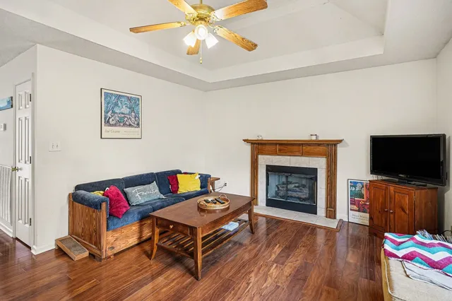 a living room with furniture fireplace and flat screen tv