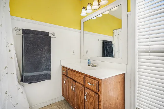a bathroom with a sink and mirror