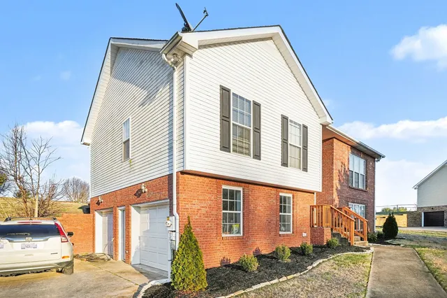 a view of a house with a street