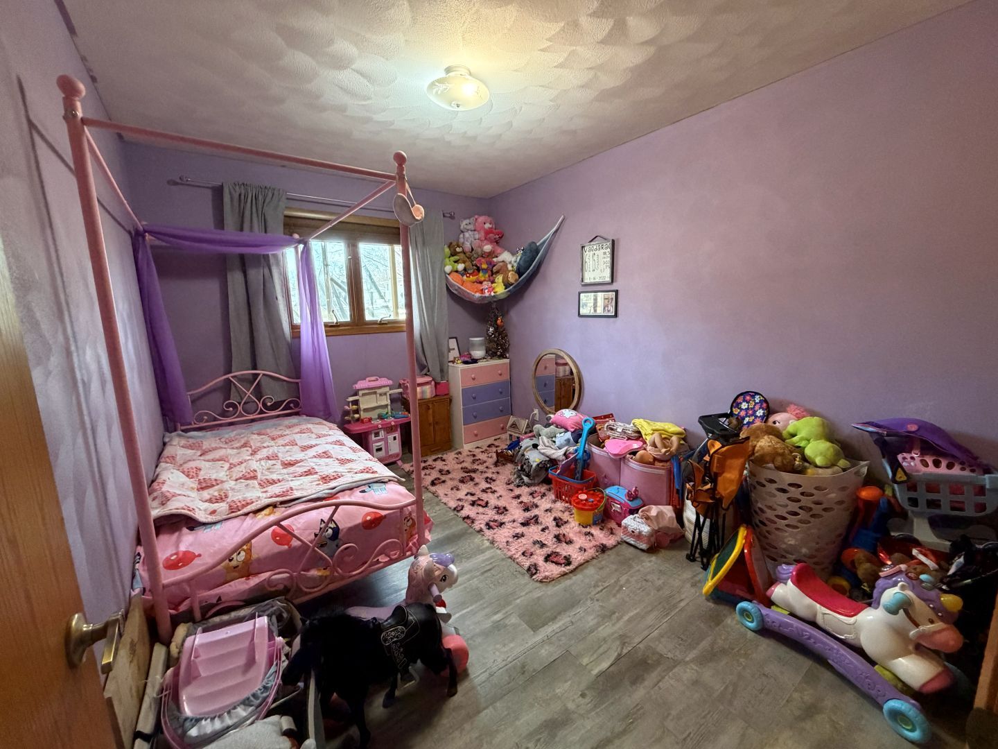 2276 Cross Street Freeport, IL 61032 - Photo 11 of 15 a bedroom with bed and a chandelier