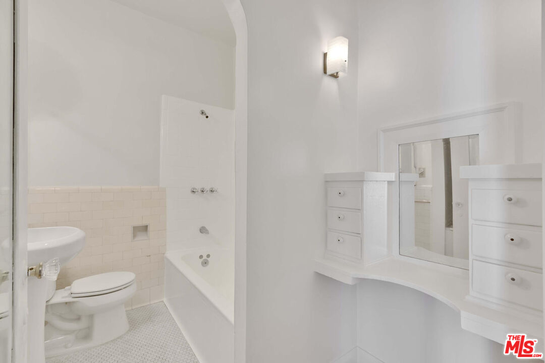 5121 1/2 Eagle Rock Boulevard, Unit E Los Angeles, CA 90065 - Photo 8 of 14 a bathroom with a toilet a sink and shower