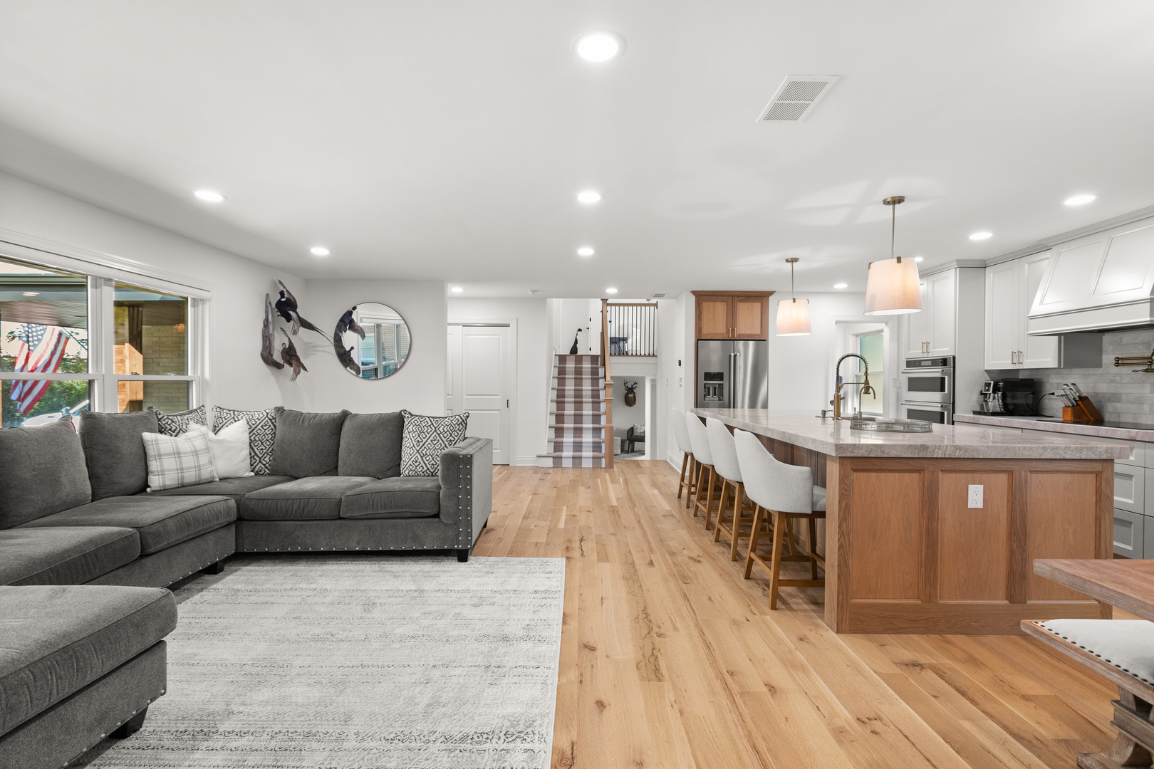 1349 Tinker Way Glenview, IL 60025 - Photo 16 of 42 a living room with furniture and a wooden floor