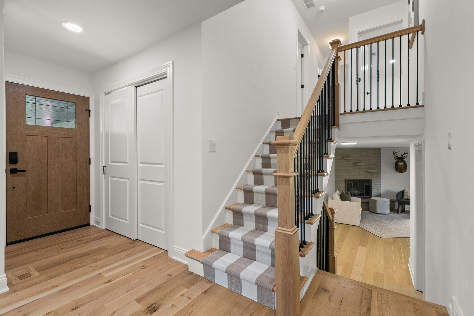 1349 Tinker Way Glenview, IL 60025 - Photo 17 of 42 a view of a hallway with wooden floor and entryway
