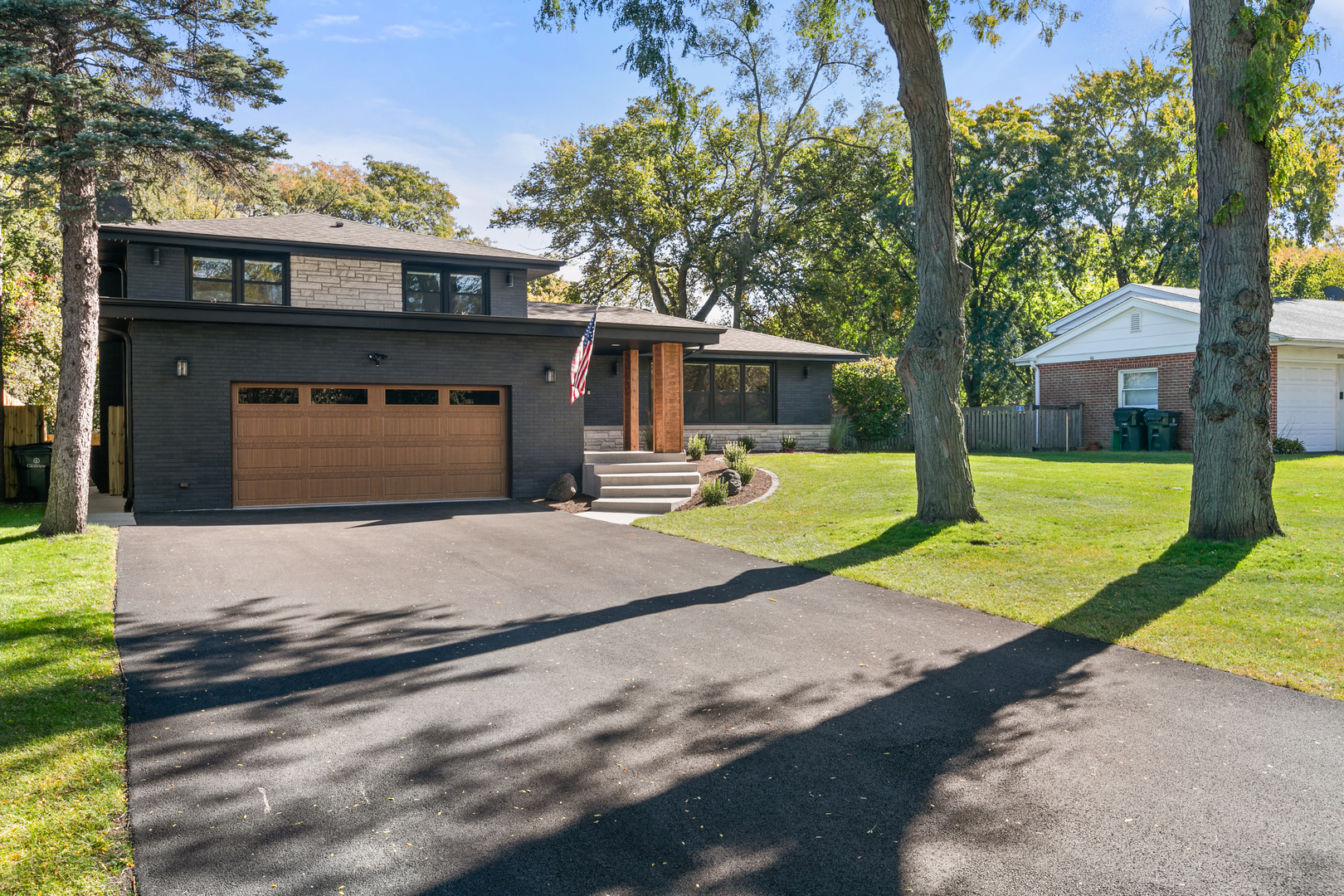 1349 Tinker Way Glenview, IL 60025 - Photo 2 of 42 a view of a house with backyard and a tree