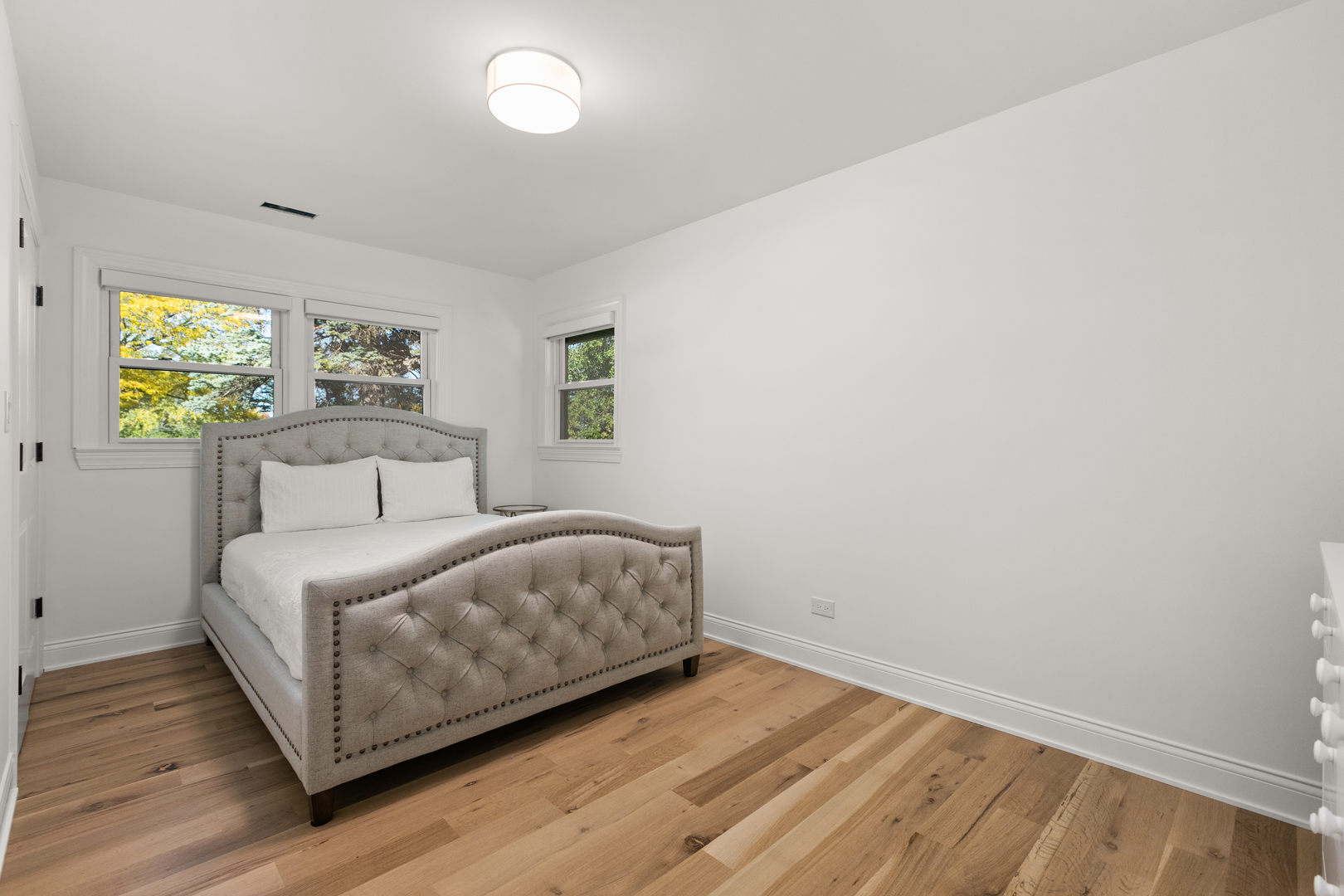 1349 Tinker Way Glenview, IL 60025 - Photo 24 of 42 a room with a bed and a window