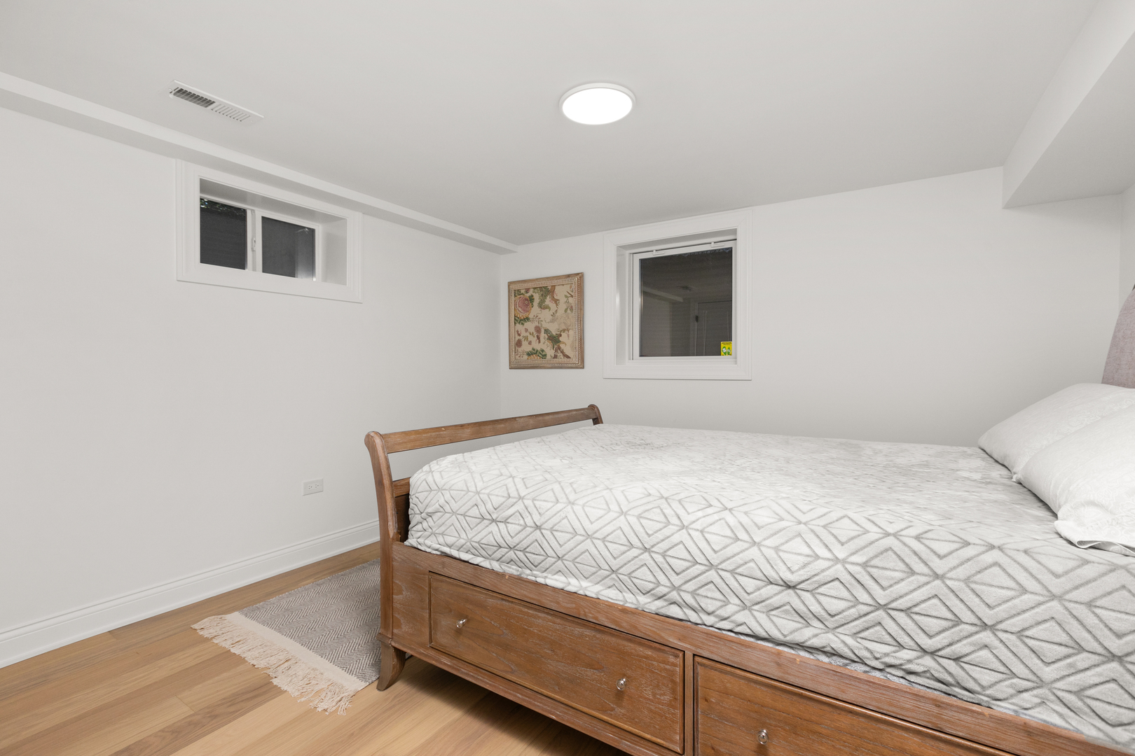 1349 Tinker Way Glenview, IL 60025 - Photo 33 of 42 a bedroom with a bed and a window