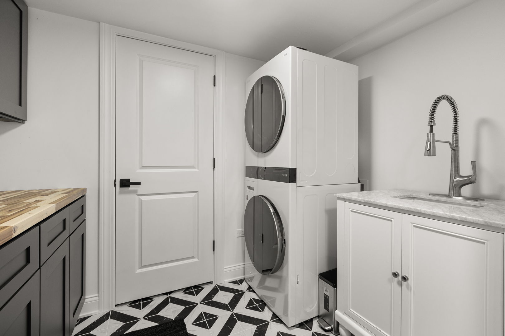 1349 Tinker Way Glenview, IL 60025 - Photo 35 of 42 a bathroom with a granite countertop sink and a mirror