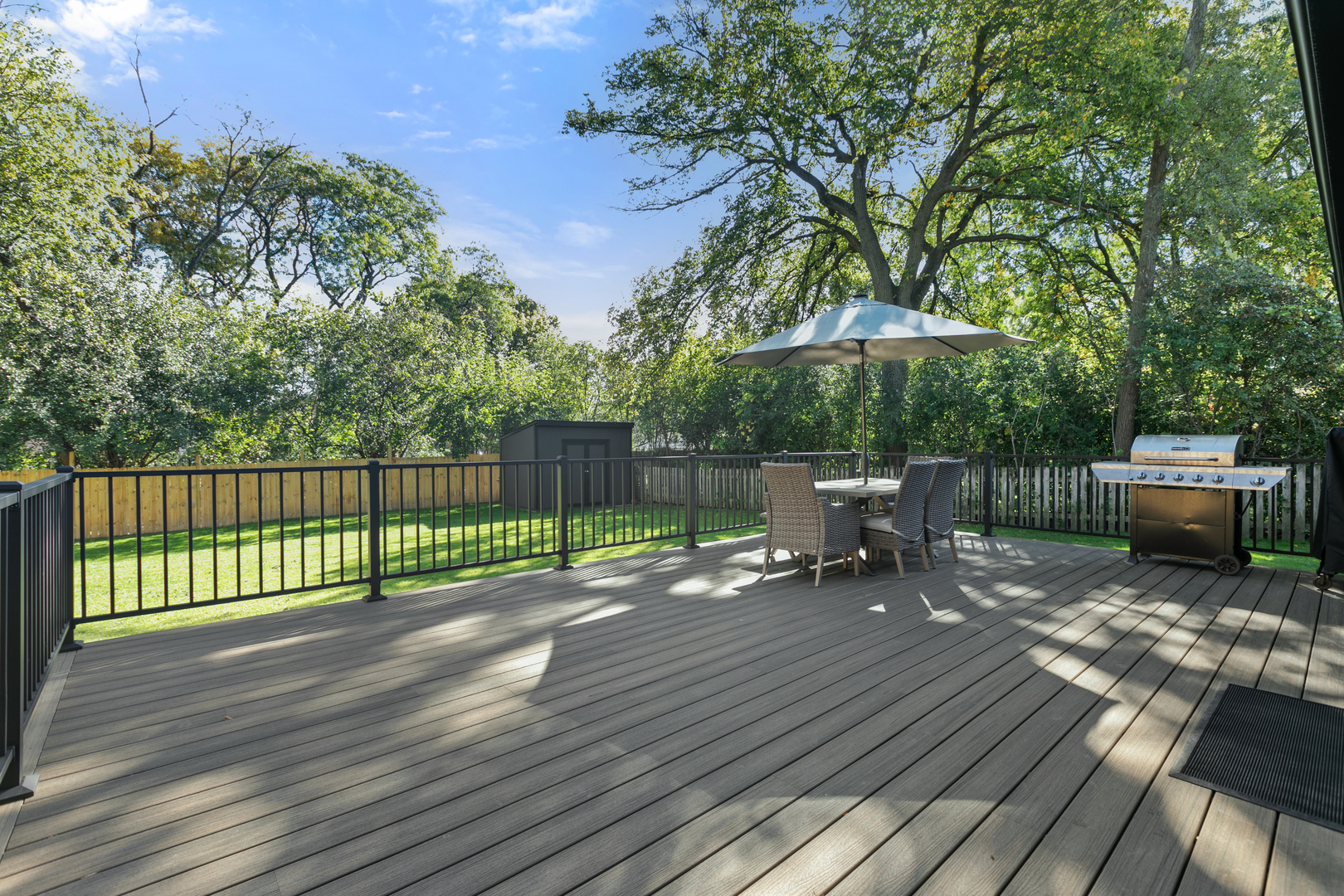 1349 Tinker Way Glenview, IL 60025 - Photo 38 of 42 a view of a deck with wooden floor and outdoor seating
