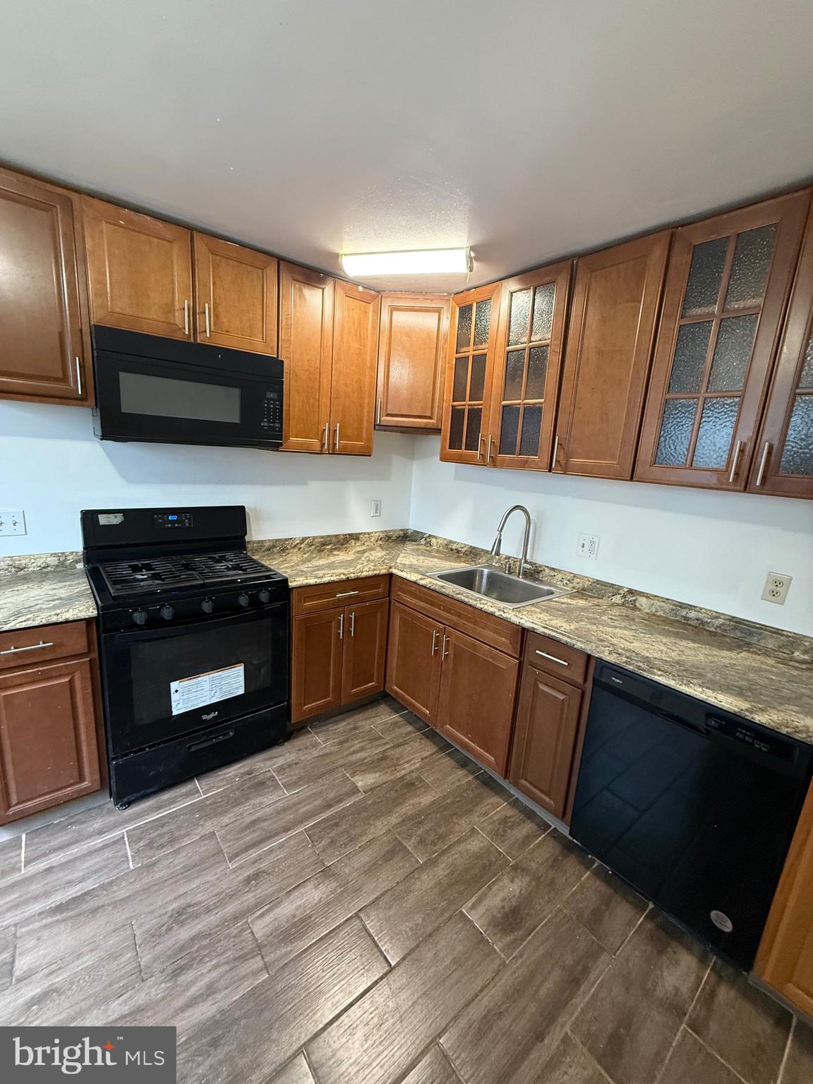 8 Hewitt Lane Sicklerville, NJ 08081 - Photo 7 of 15 a kitchen with granite countertop stainless steel appliances and sink