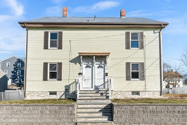 a view of a house with large windows