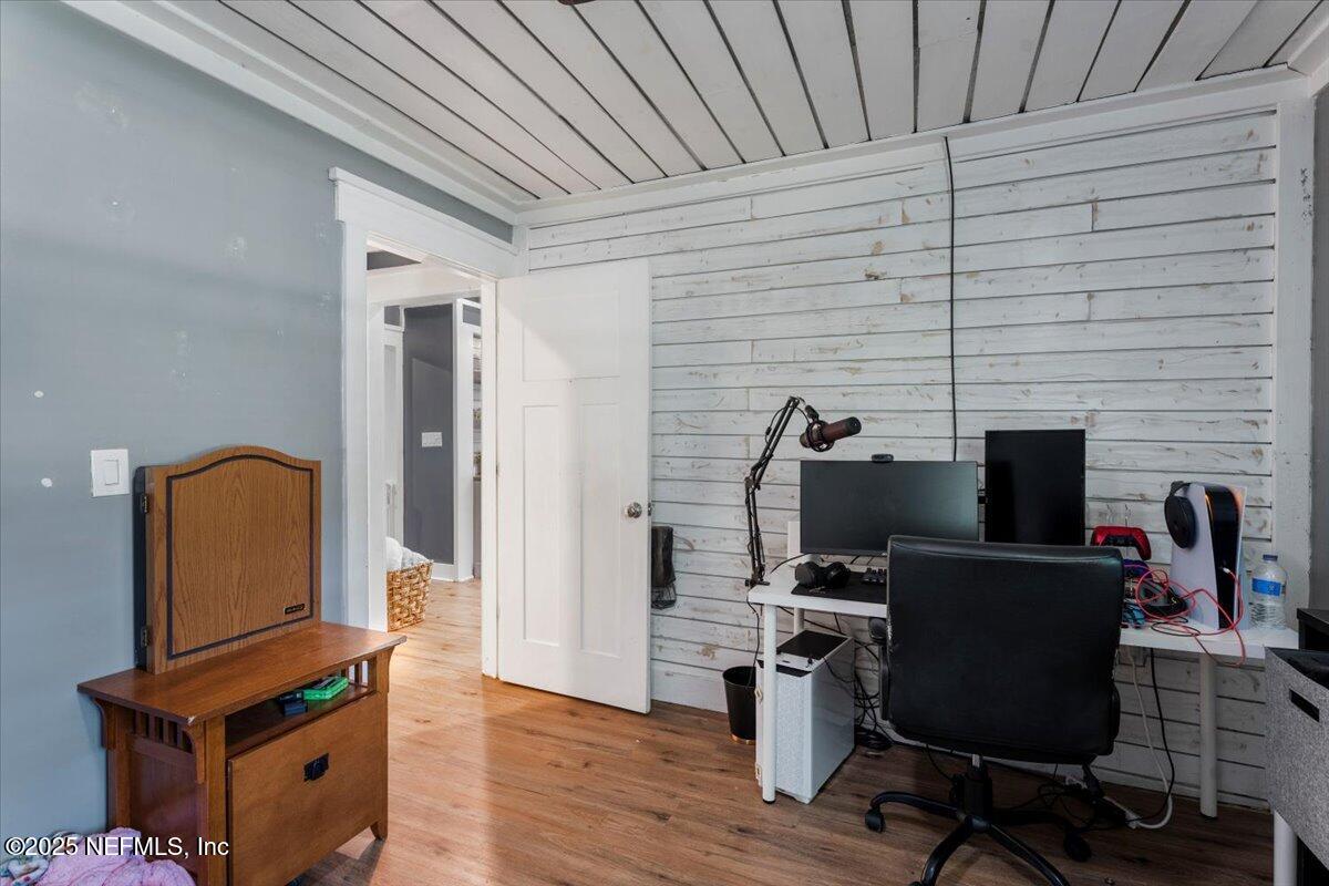 6582 Hamilton Crews Road Glen St. Mary, FL 32040 - Photo 20 of 44 a view of workspace with wooden floor windows