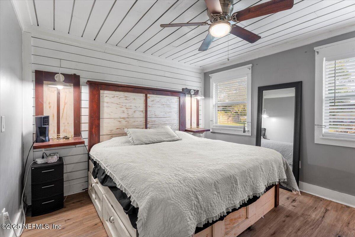 6582 Hamilton Crews Road Glen St. Mary, FL 32040 - Photo 23 of 44 a bedroom with a large bed and a large window