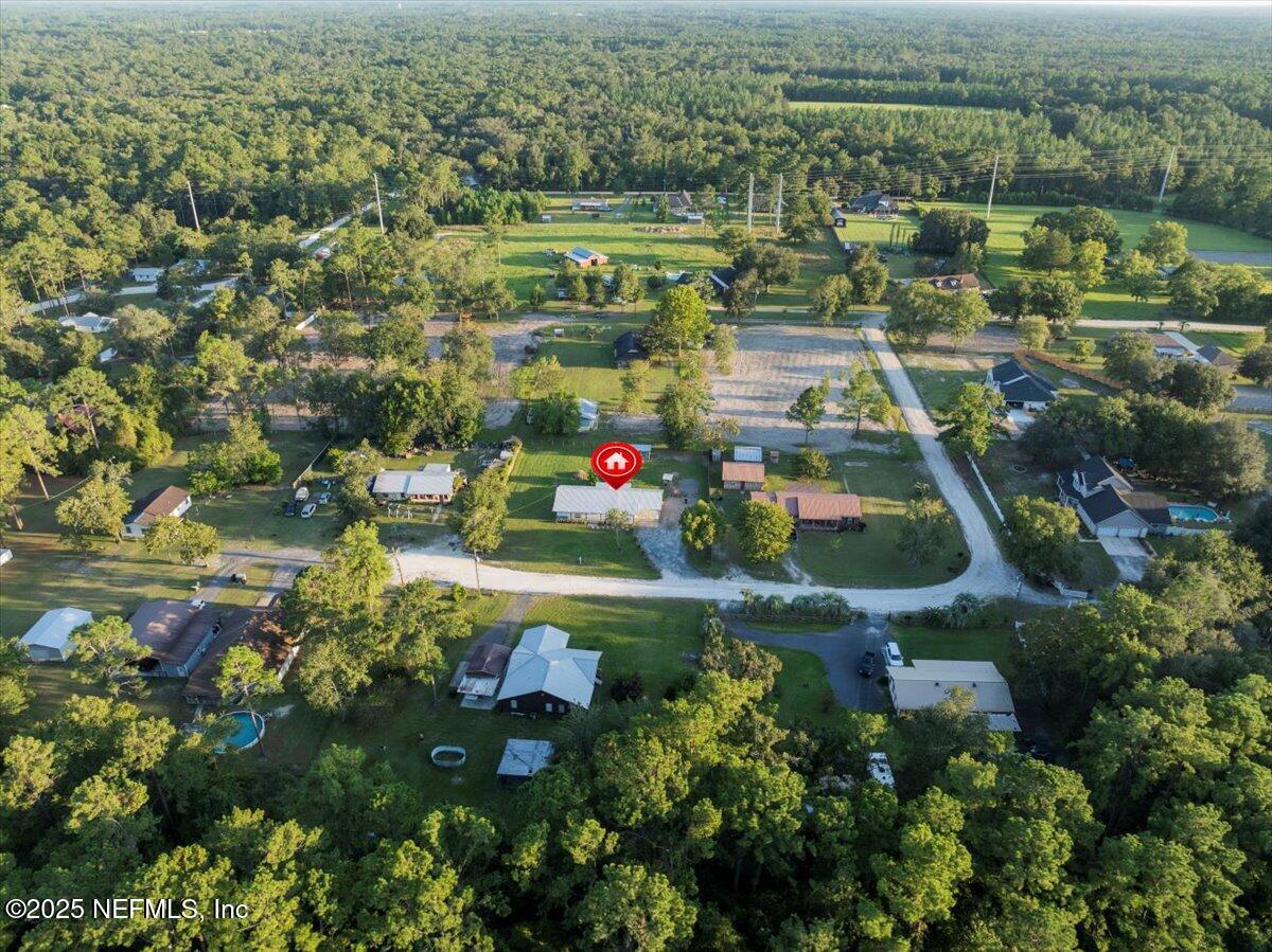 6582 Hamilton Crews Road Glen St. Mary, FL 32040 - Photo 3 of 44 an aerial view of residential houses with outdoor space and trees