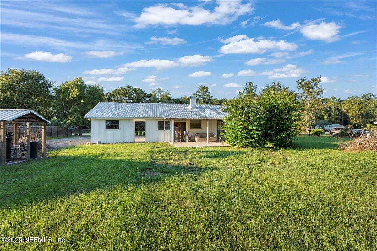 6582 Hamilton Crews Road Glen St. Mary, FL 32040 - Photo 32 of 44 a front view of house with yard and green space