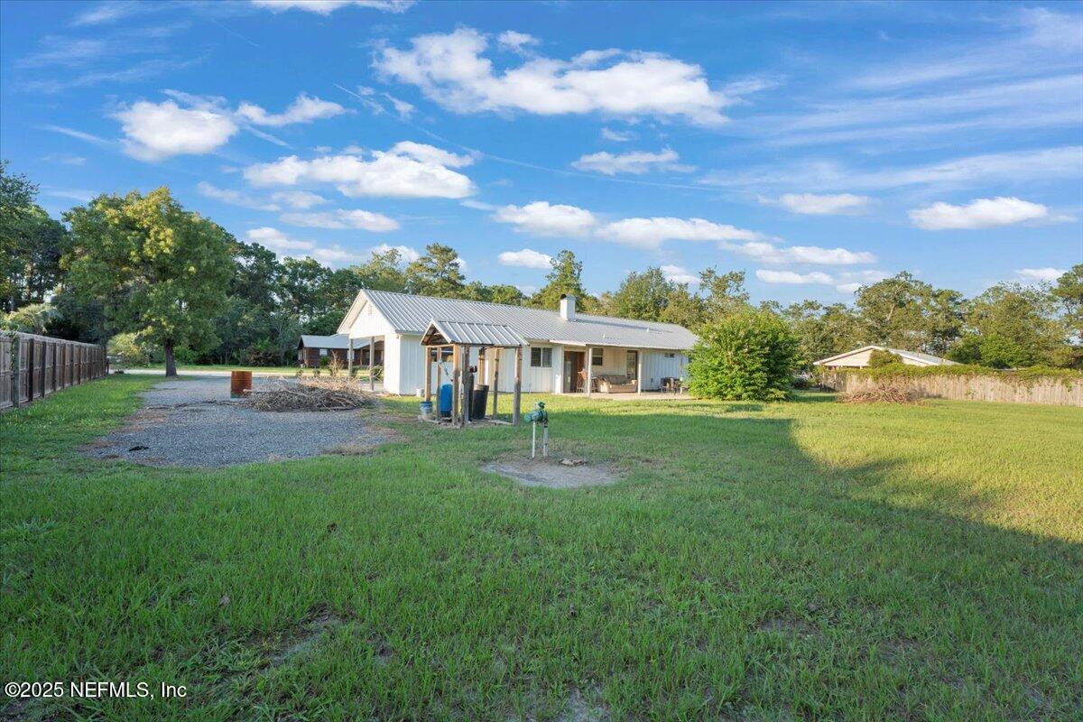 6582 Hamilton Crews Road Glen St. Mary, FL 32040 - Photo 33 of 44 a view of a house with a yard