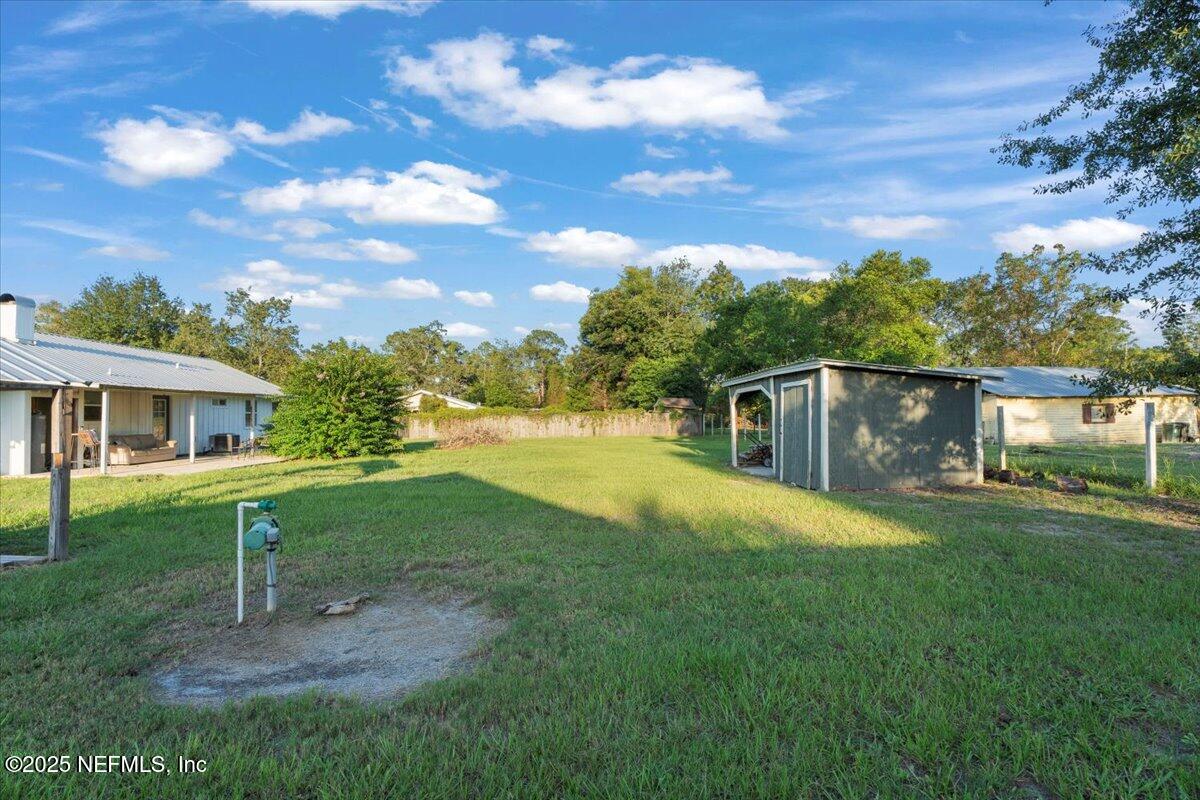 6582 Hamilton Crews Road Glen St. Mary, FL 32040 - Photo 34 of 44 a view of a house with a yard