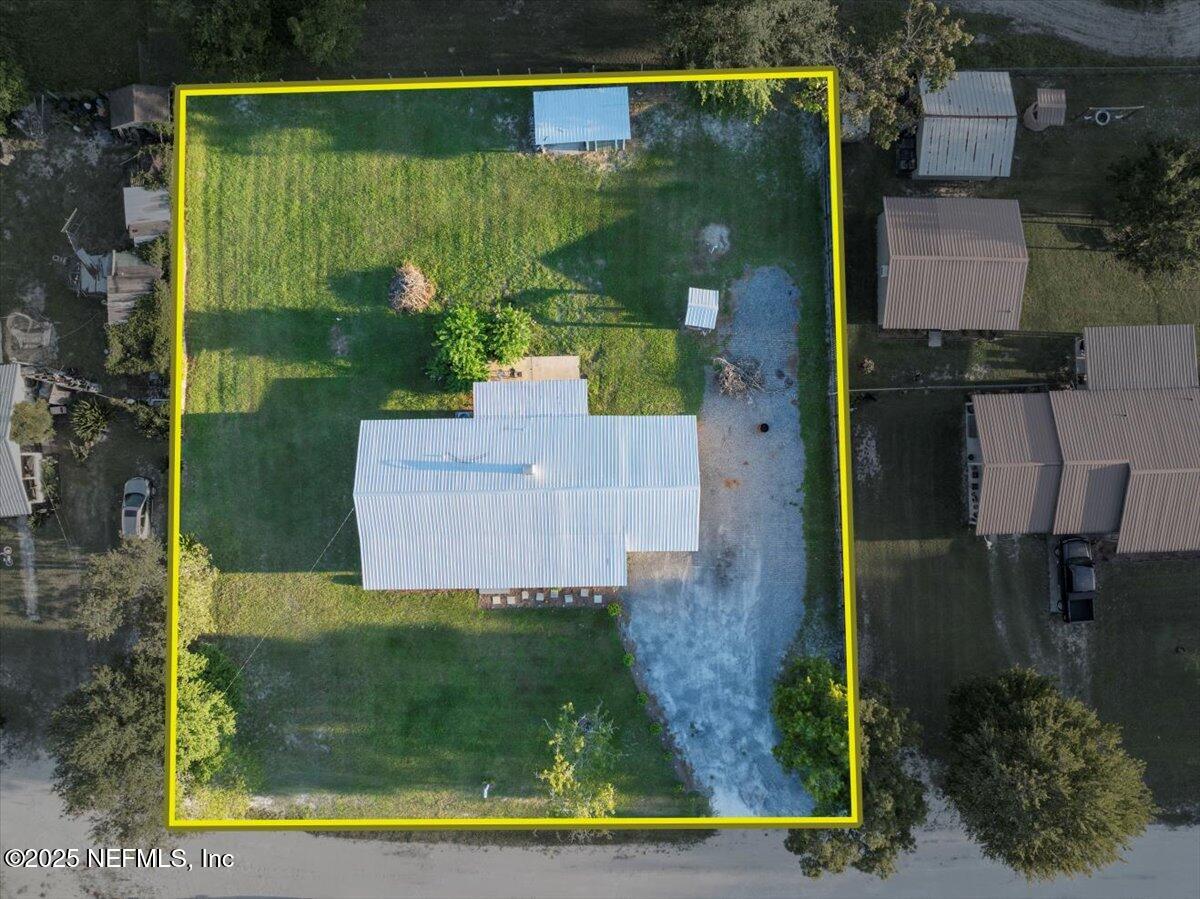 6582 Hamilton Crews Road Glen St. Mary, FL 32040 - Photo 40 of 44 an aerial view of a house with a yard