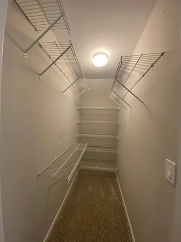 a view of a room with racks on the wall