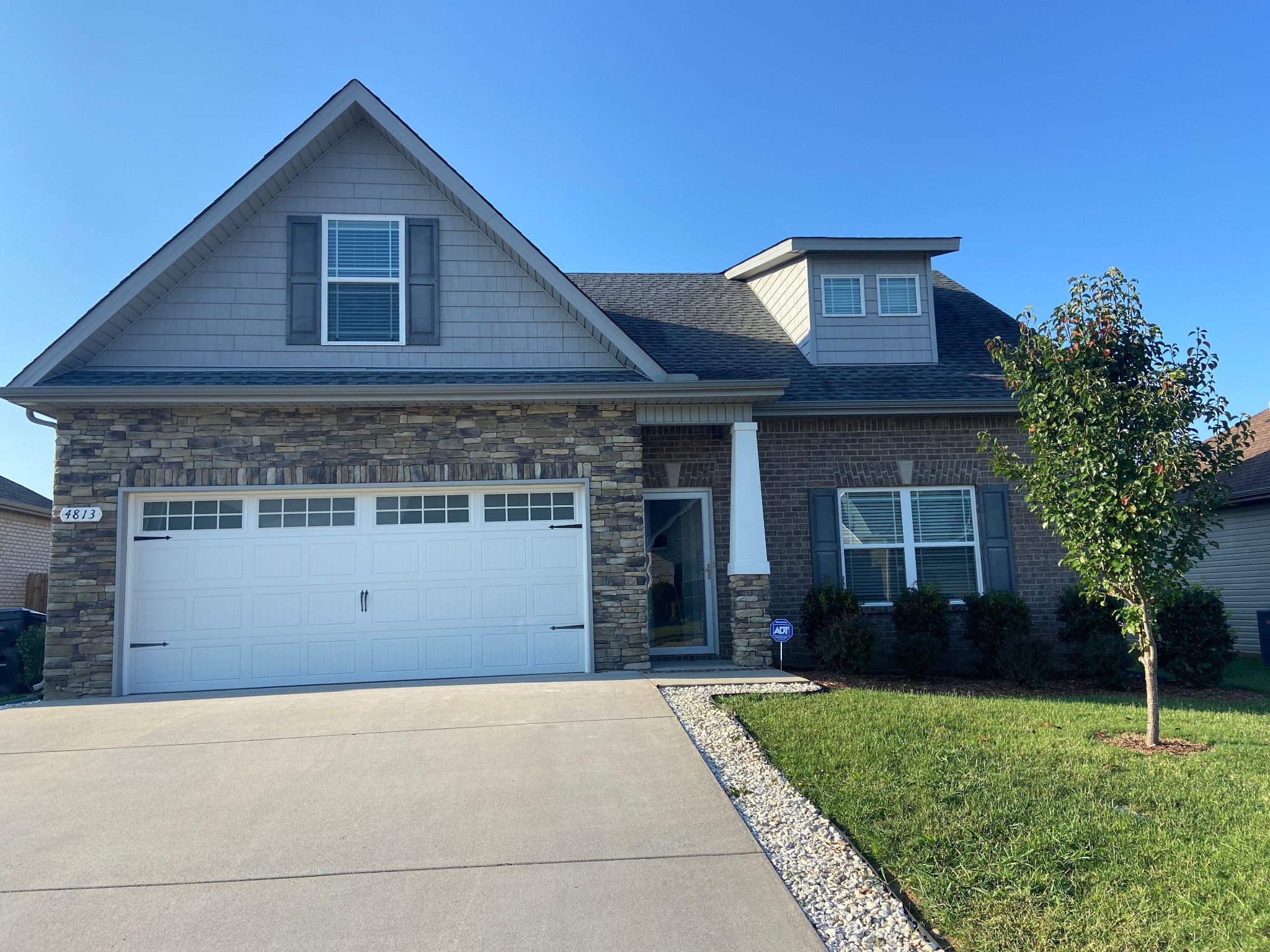 4813 Compassion Lane Murfreesboro, TN 37128 - Photo 2 of 17 a front view of a house with a garden