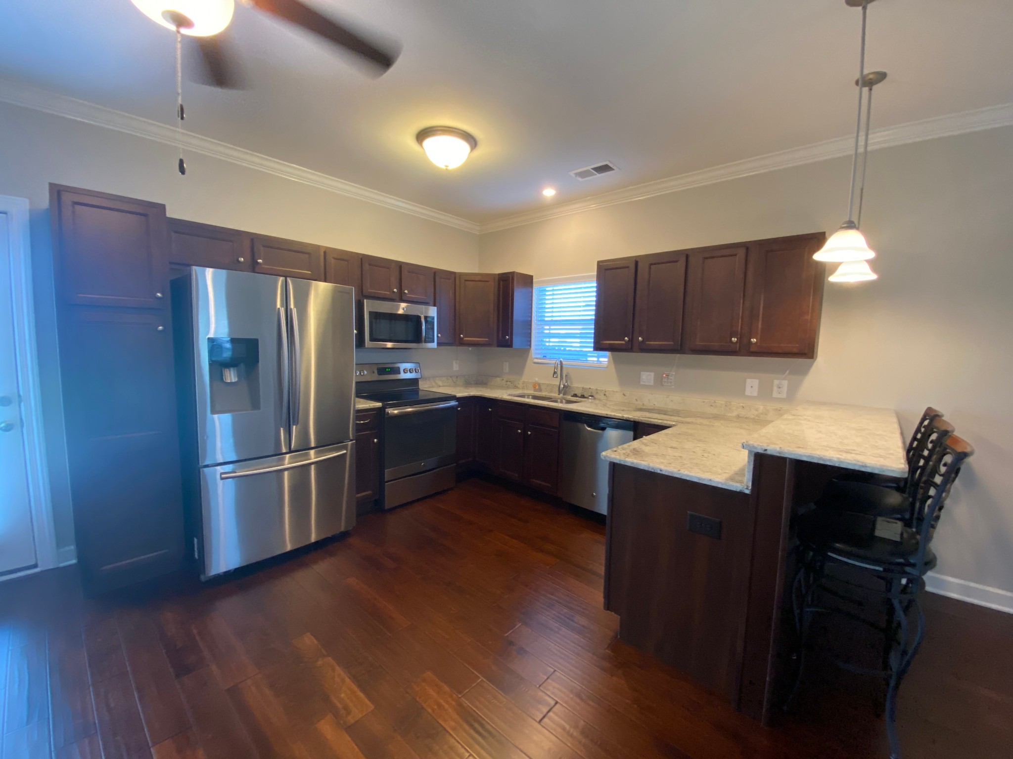 4813 Compassion Lane Murfreesboro, TN 37128 - Photo 5 of 17 a kitchen with kitchen island a counter space a sink appliances and cabinets