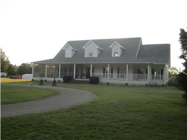 8244 Jordan Road Baker, FL 32531 - Photo 1 of 32 a front view of a house with a garden