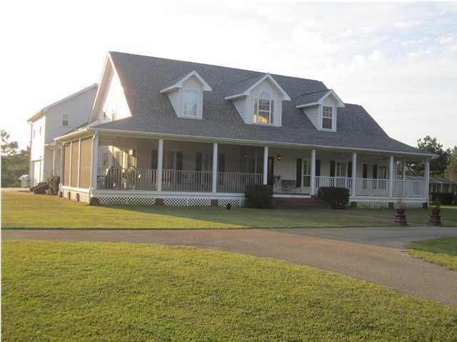8244 Jordan Road Baker, FL 32531 - Photo 2 of 32 a front view of a house with a garden