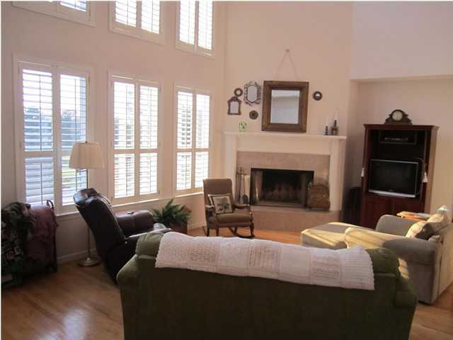 8244 Jordan Road Baker, FL 32531 - Photo 18 of 32 a bedroom with a bed a fireplace and a large window