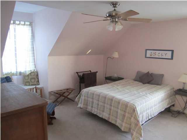 8244 Jordan Road Baker, FL 32531 - Photo 20 of 32 a bedroom with a bed ceiling fan and a window