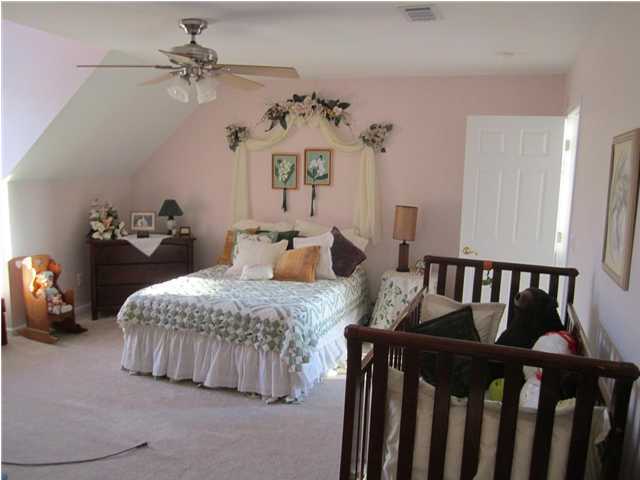 8244 Jordan Road Baker, FL 32531 - Photo 23 of 32 a bedroom with furniture and a chandelier