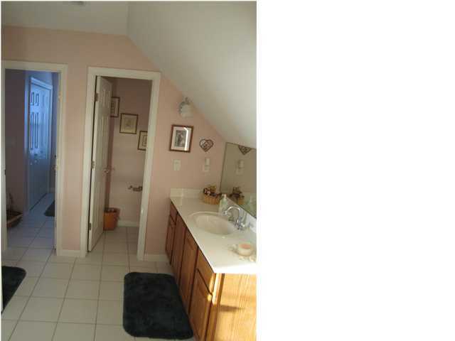 8244 Jordan Road Baker, FL 32531 - Photo 24 of 32 a bathroom with a sink and a mirror