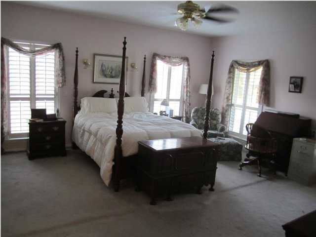8244 Jordan Road Baker, FL 32531 - Photo 27 of 32 a bedroom with a bed and a couch