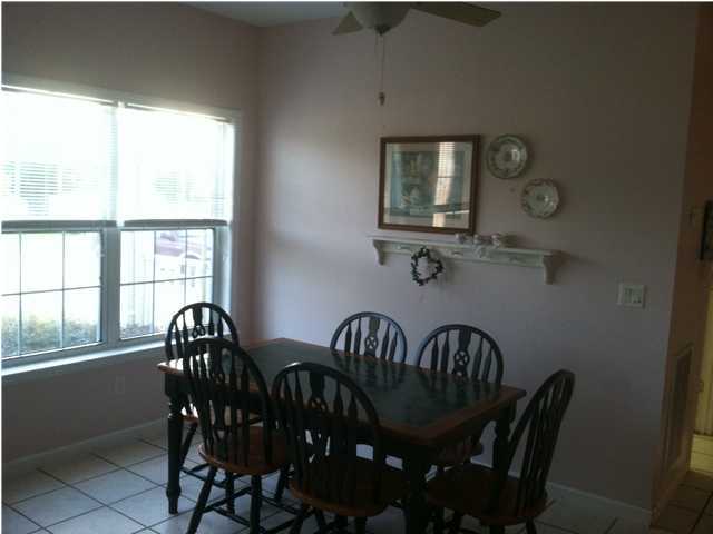 8244 Jordan Road Baker, FL 32531 - Photo 29 of 32 a view of a dining room with furniture window and outside view