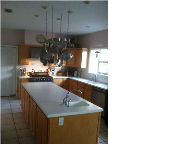 8244 Jordan Road Baker, FL 32531 - Photo 31 of 32 a kitchen with counter top space and cabinets