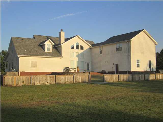8244 Jordan Road Baker, FL 32531 - Photo 7 of 32 a view of house with backyard and outdoor seating