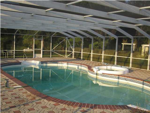 8244 Jordan Road Baker, FL 32531 - Photo 8 of 32 a view of a house with a backyard