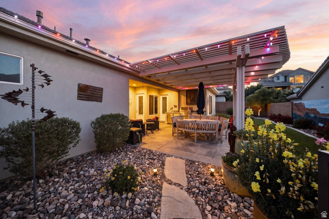 2829 East 1880th Street South St. George, UT 84790 - Photo 44 of 54 Patio terrace at dusk with outdoor dining space, a patio, and a pergola