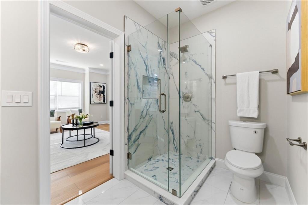 2990 Shallowford Road Atlanta, GA 30341 - Photo 13 of 34 a bathroom with a toilet a sink and shower