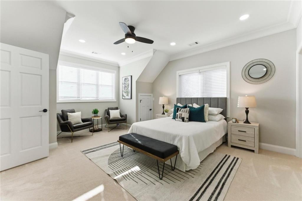 2990 Shallowford Road Atlanta, GA 30341 - Photo 28 of 34 a spacious bedroom with a bed and a chandelier
