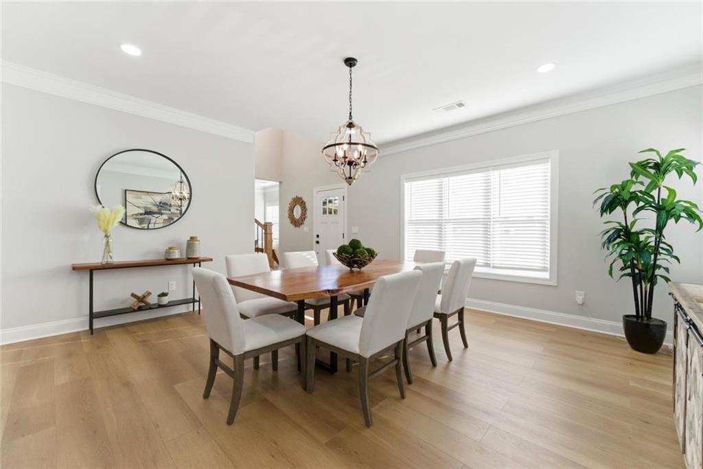 2990 Shallowford Road Atlanta, GA 30341 - Photo 3 of 34 a view of a dining room with furniture window and wooden floor