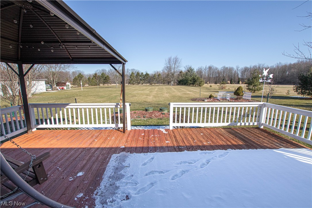 9459 Stone Road Litchfield, OH 44253 - Photo 29 of 50 Wooden terrace with a lawn and a gazebo
