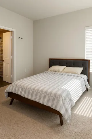 a bedroom with a bed and closet