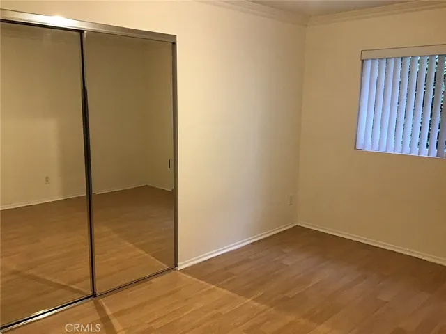 a bathroom with a sink a mirror and a window