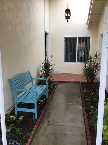 a swimming pool with outdoor seating and yard