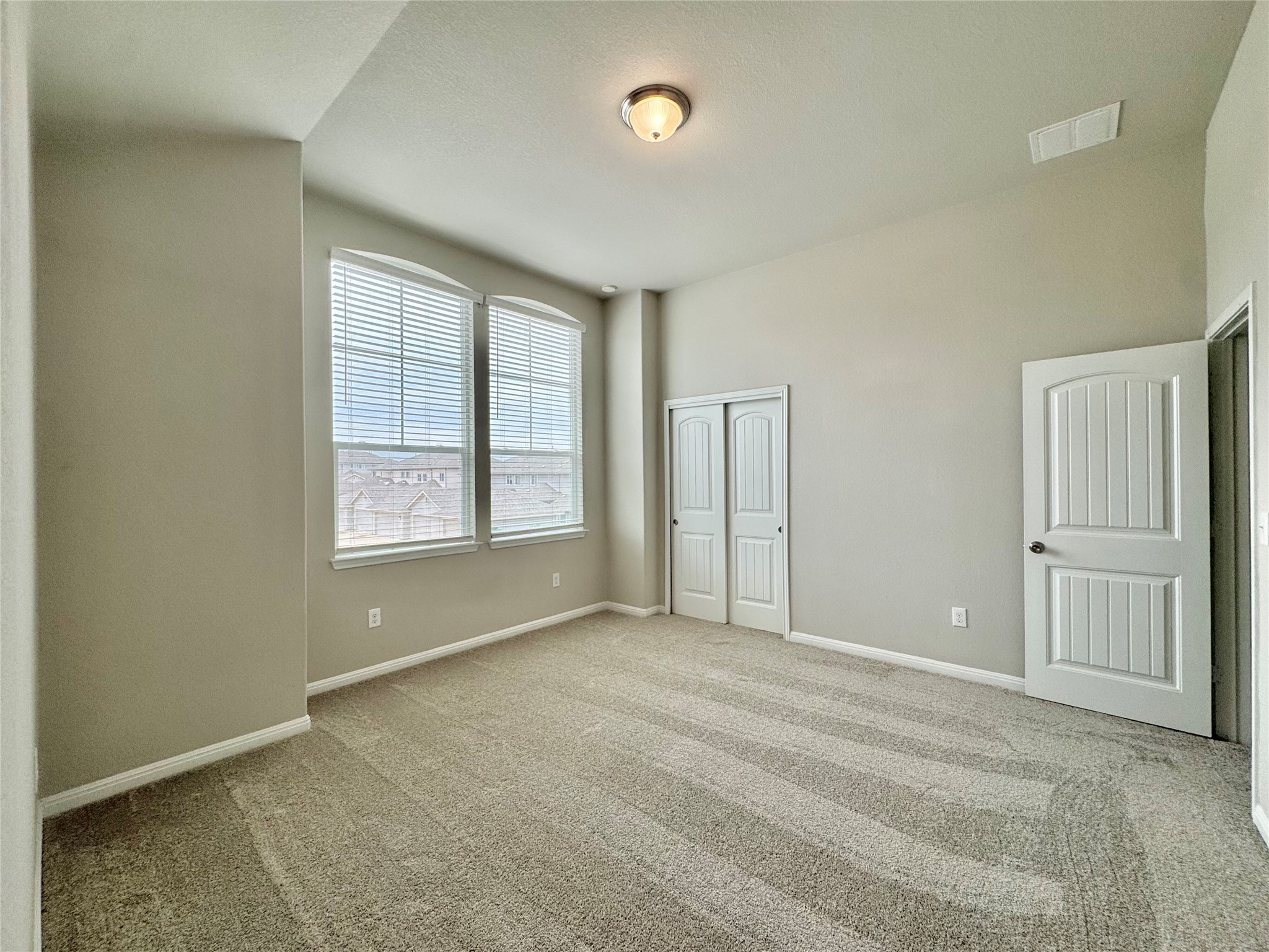 407 Rhetoric Way Pflugerville, TX 78660 - Photo 18 of 38 an empty room with windows and closet