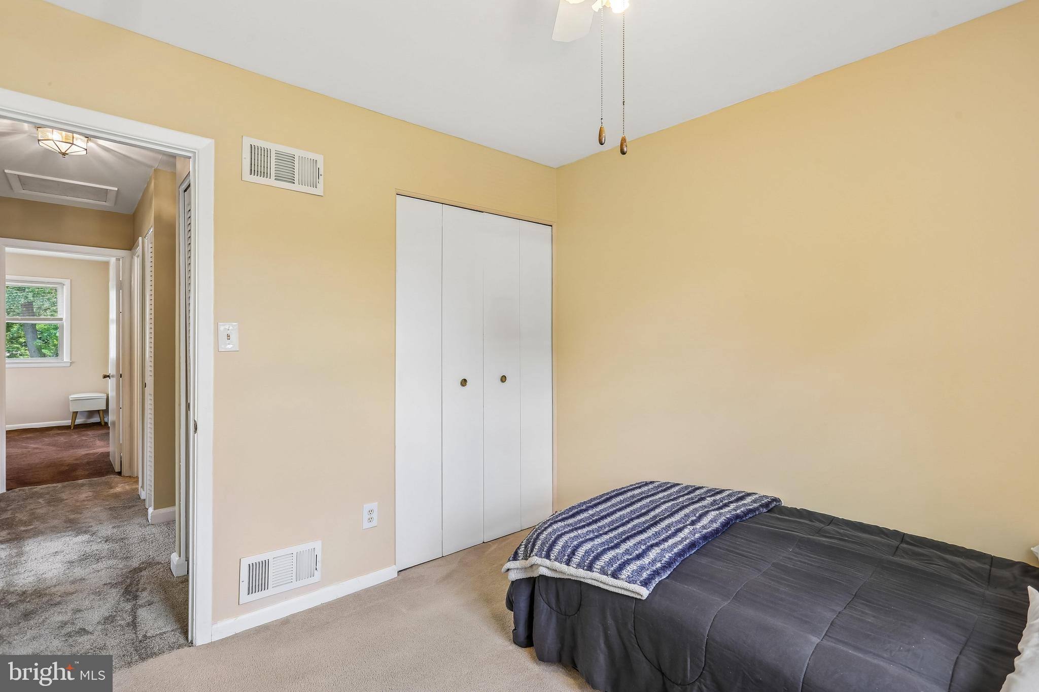 2 Foxhall Court Silver Spring, MD 20906 - Photo 49 of 86 a bedroom with a bed and a chandelier