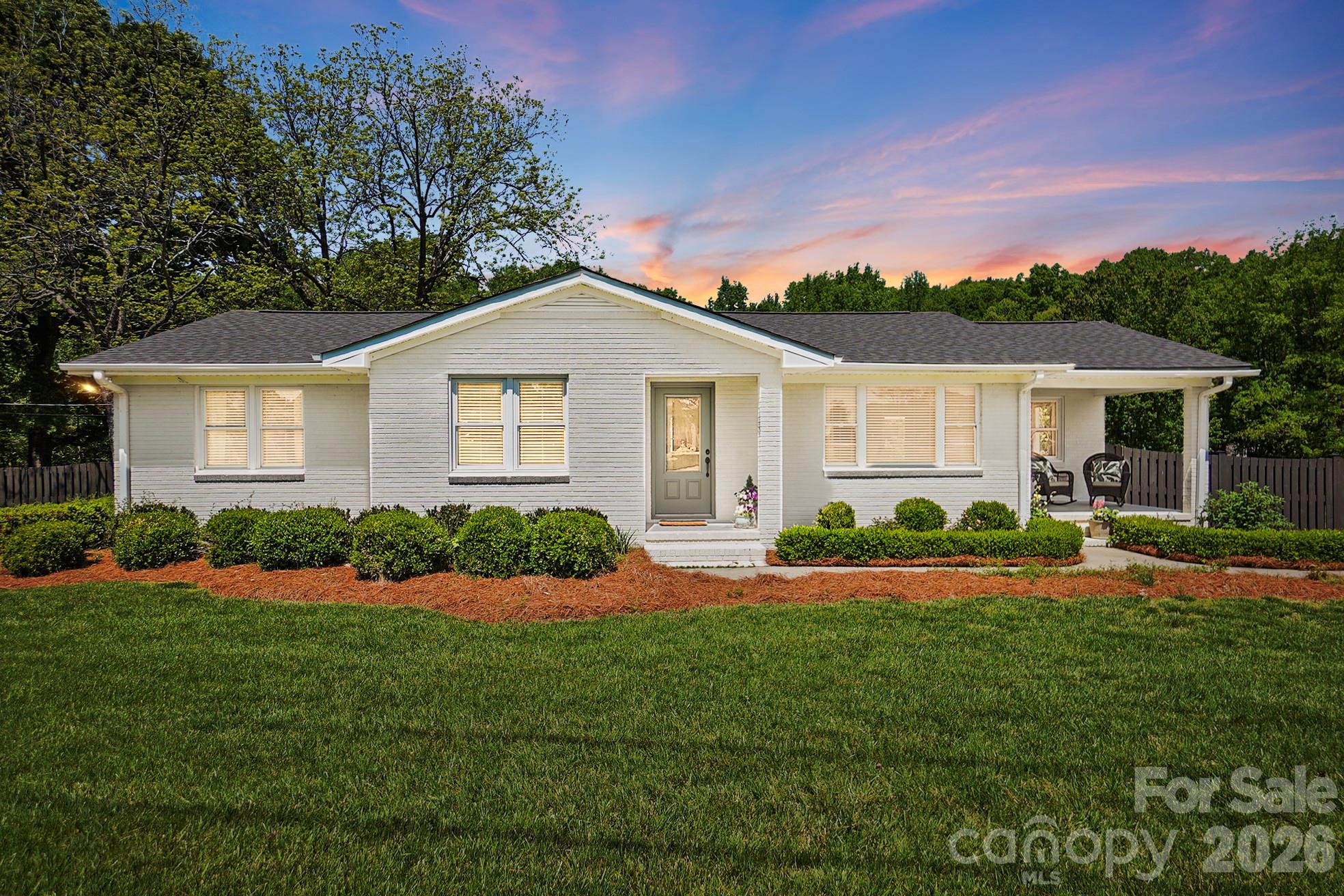 411 Baucom Deese Road Monroe, NC 28110 - Photo 2 of 45 a front view of a house with a yard and garage