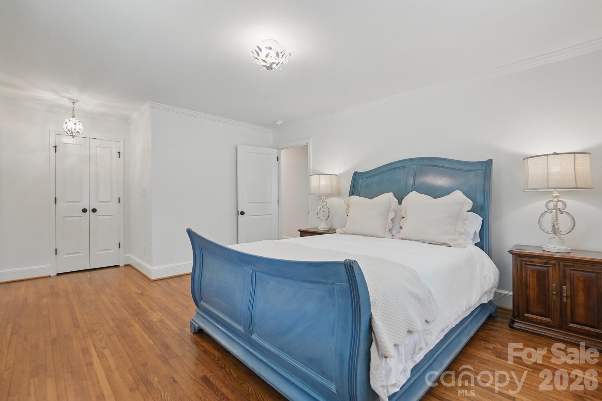 411 Baucom Deese Road Monroe, NC 28110 - Photo 22 of 45 a spacious bedroom with a bed and a lamp