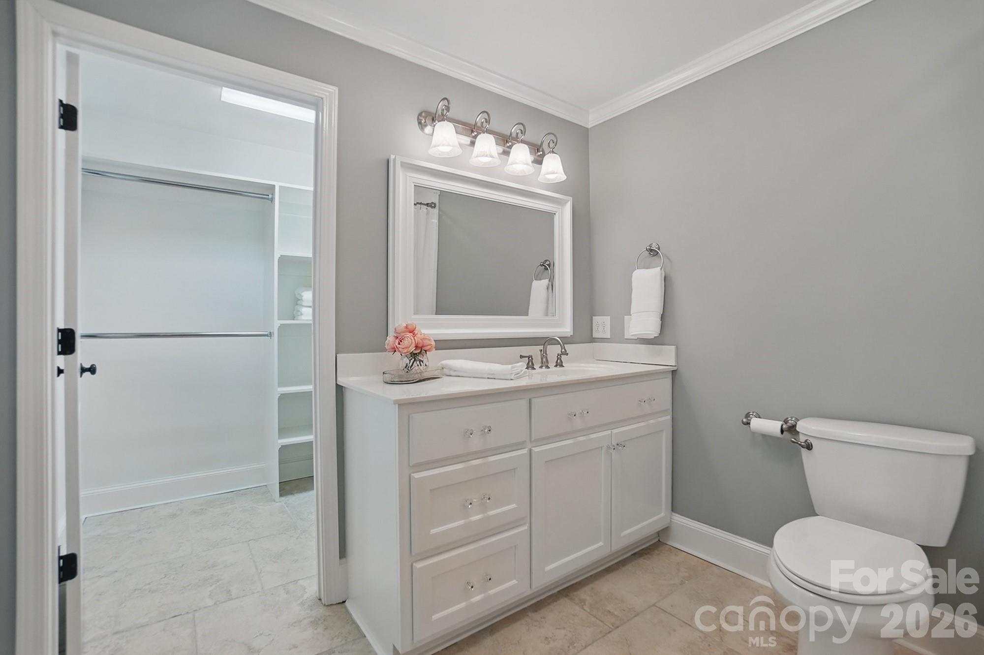 411 Baucom Deese Road Monroe, NC 28110 - Photo 23 of 45 a bathroom with a toilet sink and mirror