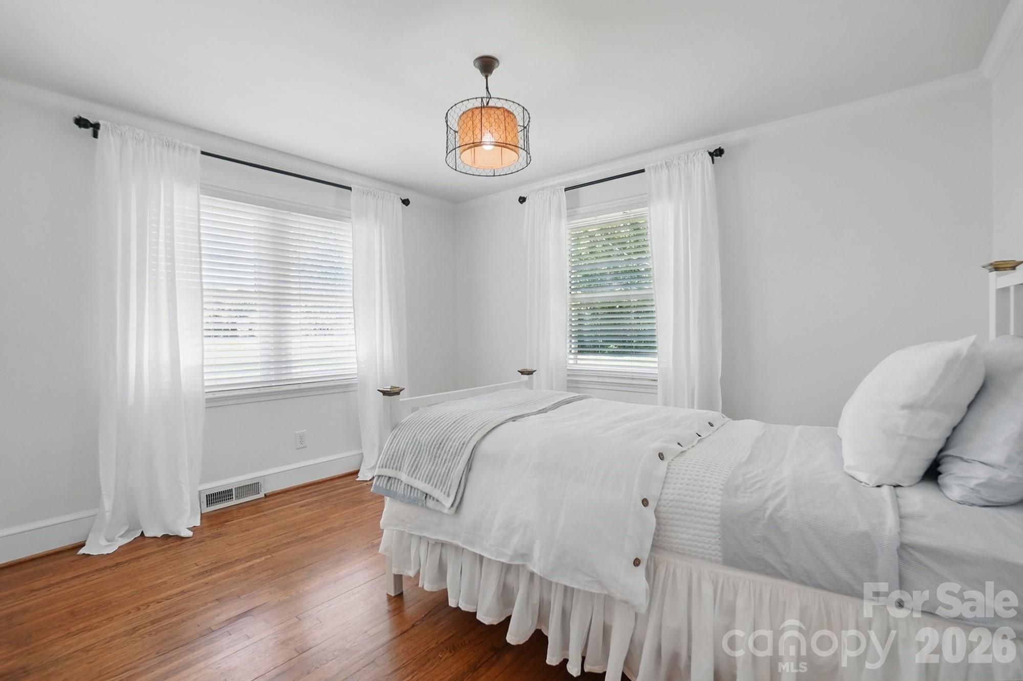 411 Baucom Deese Road Monroe, NC 28110 - Photo 24 of 45 a bedroom with a bed and a window